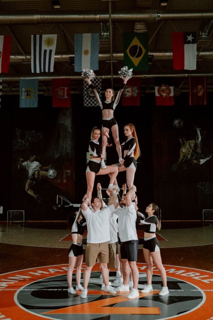 Cheerleaders Creating Cheer Pyramid in Gym